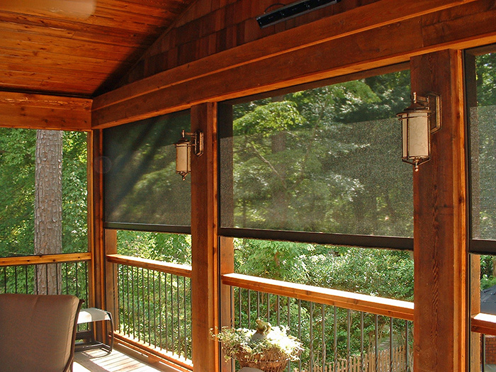 The interior of a raised cedar sunroom with retractable screens